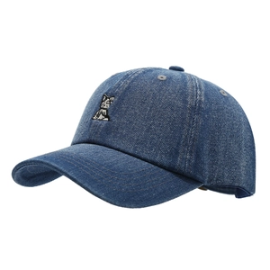 Washed denim baseball cap with vintage cat embroidery in a classic navy blue finish