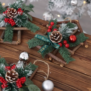 Mini Christmas pine needles wreath with red berries and Happy Christmas ribbon on wood star