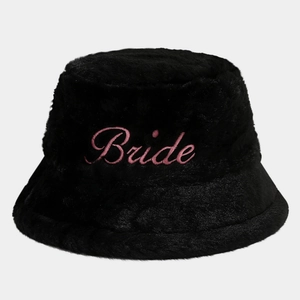 Close-up of pink Bride embroidery on a black faux fur winter bucket hat for parties