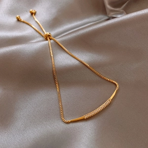 Adjustable gold cat eye bracelet with moon and star zircon on champagne silk background