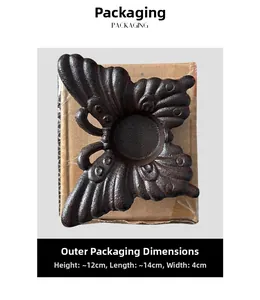 Détail du bougeoir papillon en fonte vintage avec des dimensions de 12x14x4cm