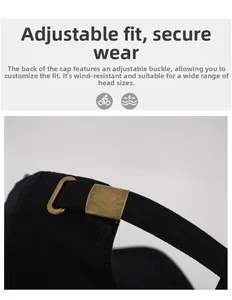 Detail of adjustable antique bronze metal buckle on black mesh textured baseball cap