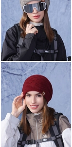 Close-up of winter knit beanies in grey and burgundy with premium ribbed texture
