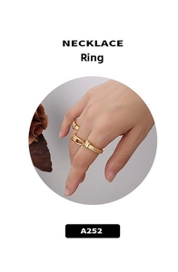 Detailed close-up of a vintage knot design ring with 18k gold plating finish