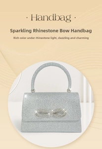 Close-up of sparkling silver glitter texture and rhinestone bow detail on handbag