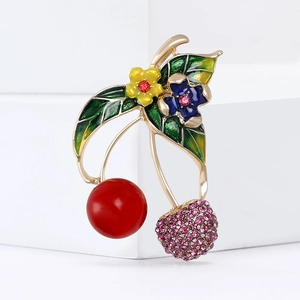 Cute alloy cherry brooch with pink rhinestones and colorful enamel on a white background