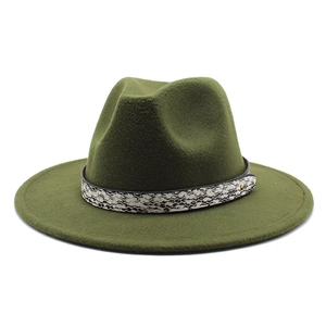 Detail of dark green wool fedora hat featuring a stylish snakeskin band and gold button