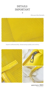 Detail of yellow mesh beach bag showing high-density honeycomb grid and premium zipper
