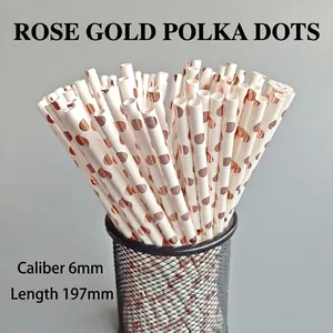 Rose gold foil dot paper straws, 6mm x 197mm, displayed in a black wire holder