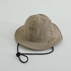 Detail of khaki quick-dry bucket hat with adjustable woven chin strap and side embroidery
