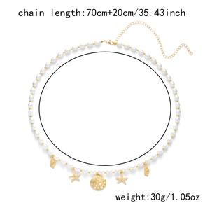 Detail of 70cm+20cm summer waist chain with pearls, starfish charms and shell pendants