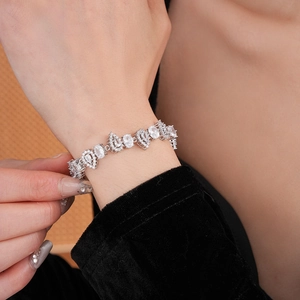 Close-up of a silver zircon water drop bracelet worn on wrist showing elegant details