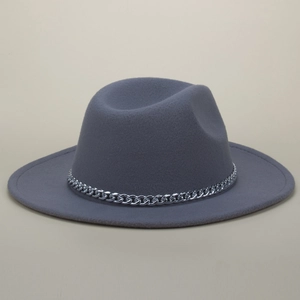 Detail of silver chain trim on a dark grey wool fedora hat with elegant wide brim