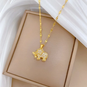 Macro shot of 18k gold plated elephant pendant necklace with micro-pave zircons