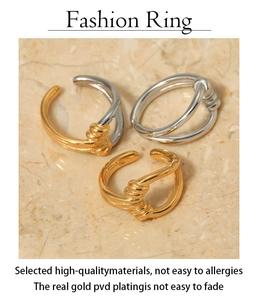 Detailed view of knot rings in gold and silver finish with 18K PVD plating texture
