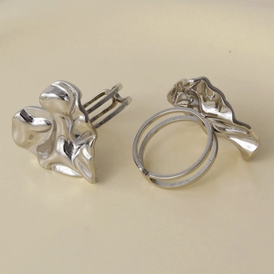 Detailed macro view of silver 304 stainless steel rings with irregular lava texture