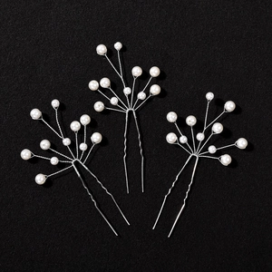 Elegant bridal pearl U-shaped hair pins set with silver floral branch design for weddings