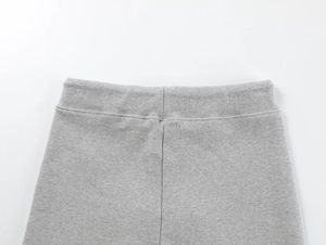 Macro shot of grey high-waisted yoga shorts showing fine knitted fabric texture