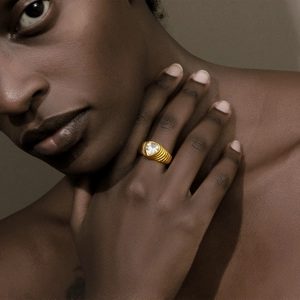 18K gold plated stainless steel heart zircon ring with textured band on a model