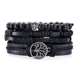Close-up of four-piece men's bracelet set with Tree of Life and cross shield charms