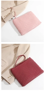 Detail of hand-woven leather clutches in pink and burgundy with premium woven texture