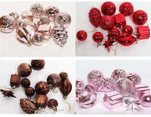 Detail view of assorted Christmas ornaments in rose gold, red, bronze, and pink colors