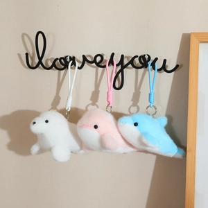 Plush dolphin keychain set with woven ropes in white pink and blue on a love hook