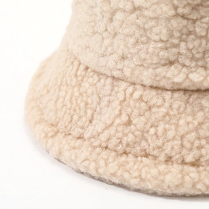 Beige faux lamb wool bucket hat for winter featuring soft teddy fleece plush texture