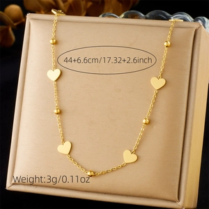 Detail of golden stainless steel heart necklace with weight and length measurements