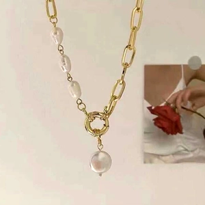 Baroque pearl and gold chain necklace with asymmetric toggle clasp and round pearl pendant
