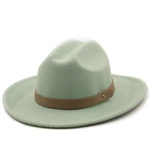 Detail of mint green wool fedora with brown faux leather band and gold stud accents