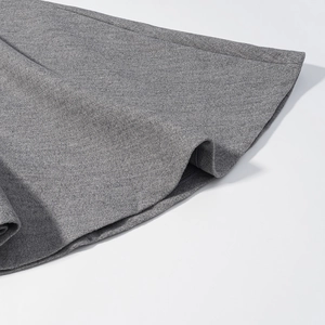 Close-up of grey wool fabric texture and high-quality hem stitching of the waist coat