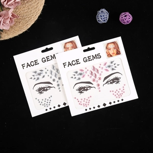 Sparkling face gems and rhinestone stickers for makeup and festive parties on black background