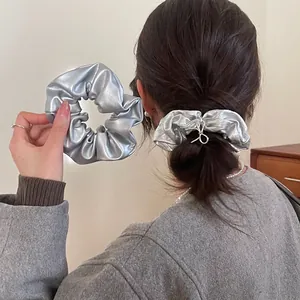 Silver metallic PU leather scrunchie with holographic y2k style for women's hair