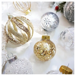 Detail of assorted gold and silver Christmas ornaments with sequins and snowflake patterns