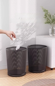Close-up of black metal mesh waste bins showcasing durable texture and sleek design