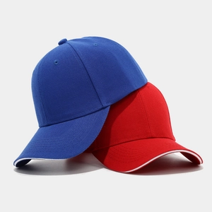 Classic cotton baseball caps in blue and red featuring sandwich bill and six-panel design