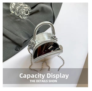 Silver metallic mini round bag interior showing storage capacity for lipstick and makeup