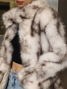 Winter women's luxury faux fur coat in grey marble texture with high collar and warm plush