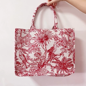 Elegant white canvas tote bag with red tiger embroidery and pearl strap detail