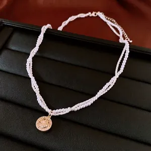 Elegante collana di perle a doppio strato placcata in oro con ciondolo a stella in zircone