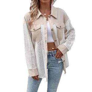 Detail of elegant beige shirt with lace stitching sleeves and front utility pockets