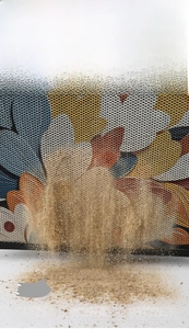 Close-up showing dust falling through the elastic silk mesh of the anti-slip entryway mat