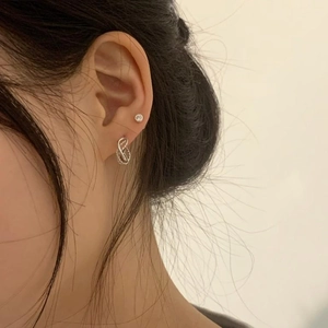 Minimalist 925 sterling silver rope twist earrings and zircon studs worn on ear