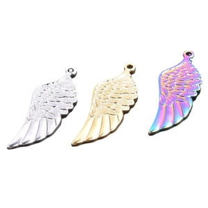 Three stainless steel angel wing pendants in silver, gold and rainbow finishes