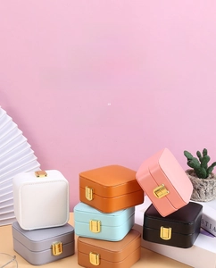 Chic multi-color leather jewelry boxes with secure gold snap button and velvet mirror interior