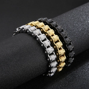 Mens biker chain bracelets in silver gold and black with diamond texture on display