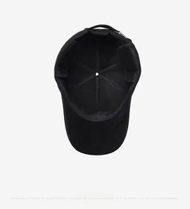 Detail of the thick fleece lining and metal adjustment buckle inside a black baseball cap