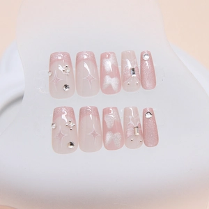 French cat eye press-on nails with shiny butterfly and silver star design in pink