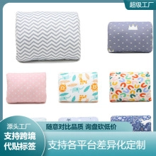 Detail showcasing multiple patterns including animals, stars, and waves on soft square pillows